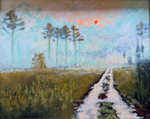 Foggy Sunrise with Sandy Road through Pines